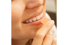 Image Smiling person with a gummie.